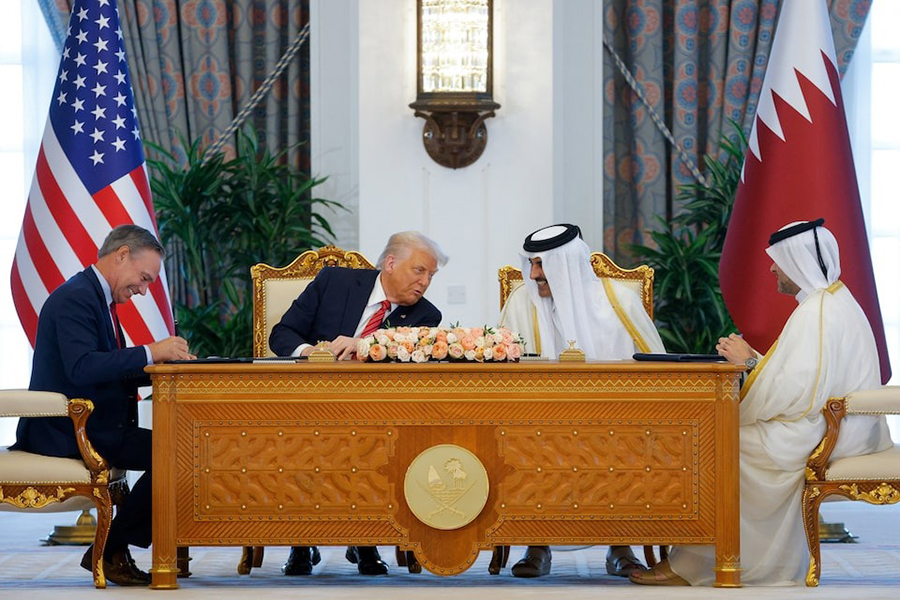 US President Donald Trump, Qatar's Emir Tamim bin Hamad Al Thani and Boeing CEO Kelly Ortberg attend a signing ceremony in Doha, Qatar on May 14, 2025 — Reuters photo