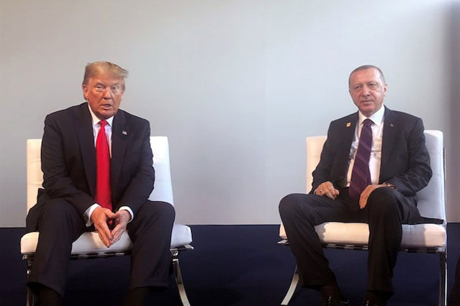 Turkish President Tayyip Erdogan meets with US President Donald Trump during the NATO summit in London, Britain, December 4, 2019.