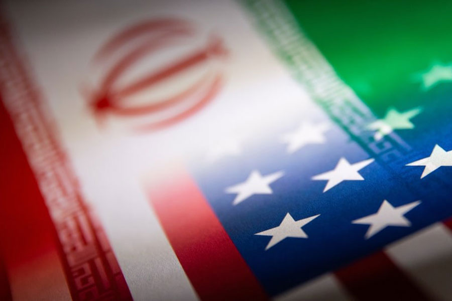 Iran's and US' flags are seen printed on paper in this illustration taken January 27, 2022.
