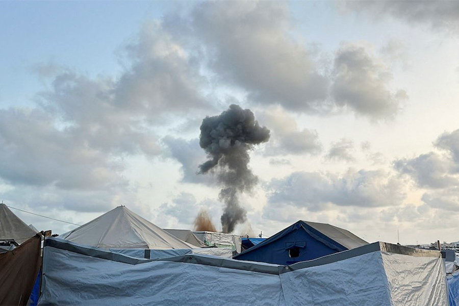 Smoke rises following Israeli strikes, as seen from a tent camp sheltering displaced Palestinians, in Khan Younis, southern Gaza Strip on May 19, 2025 — Reuters photo