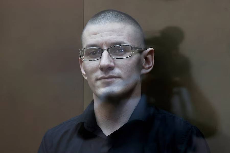 U.S. citizen Robert Woodland, arrested on suspicion of drug trafficking, sits behind a glass wall of an enclosure for defendants before a court hearing in Moscow, Russia May 30, 2024.