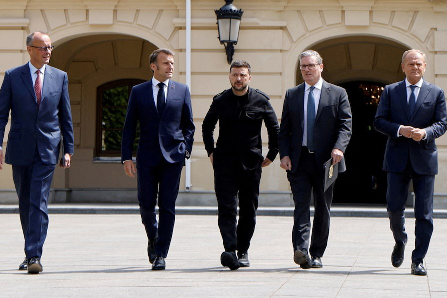 German Chancellor Friedrich Merz, French President Emmanuel Macron, Ukranian President Voloydmyr Zelensky, British Prime Minister Keir Starmer and Polish Prime Minister Donald Tusk walk in the grounds of Mariynsky Palace, in Kyiv, Ukraine on May 10, 2025 — Pool via REUTERS/File