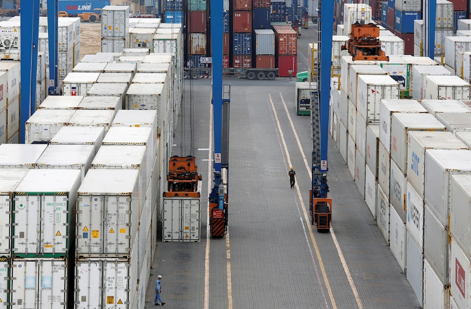 Containers are loaded at a port in Ho Chi Minh city, Vietnam July 27, 2018. REUTERS/Kham/File Photo