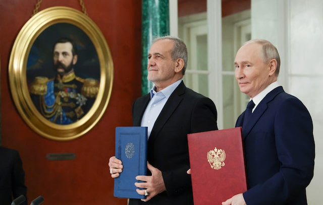 Russian President Vladimir Putin and Iranian President Masoud Pezeshkian attend a ceremony to sign an agreement of comprehensive strategic partnership between the two countries, at the Kremlin in Moscow, Russia January 17, 2025. Sputnik/Vyacheslav Prokofyev/Pool via REUTERS/File Photo