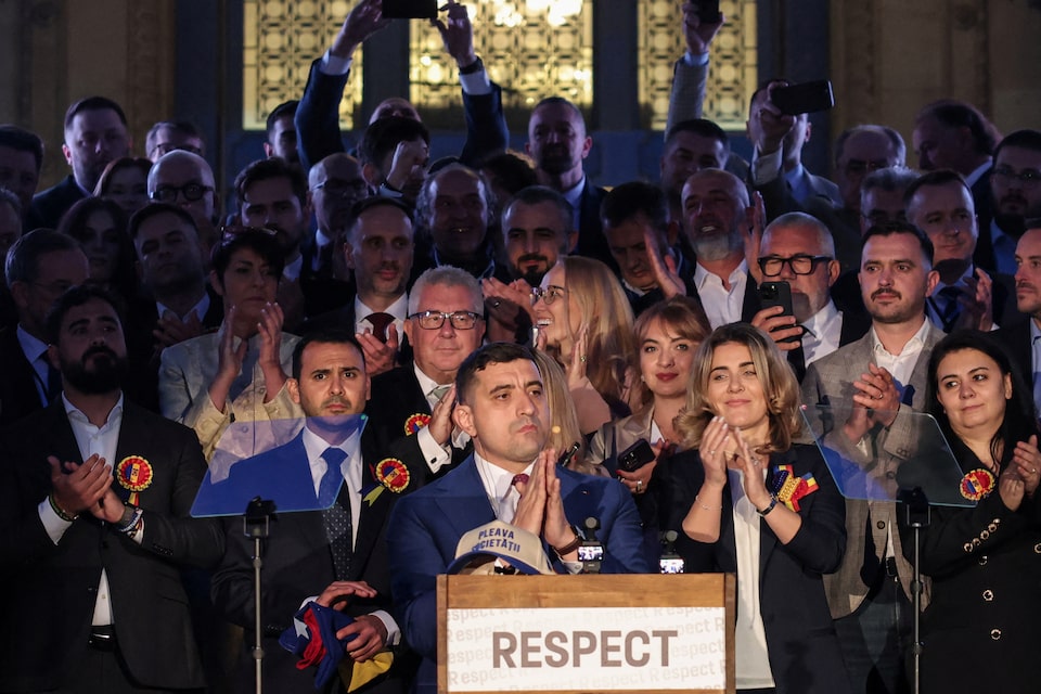Presidential candidate George Simion reacts to exit polls of Romania's second round of the presidential election, in front of the parliament in Bucharest, Romania, May 18, 2025. REUTERS/Louisa Gouliamaki/File Photo