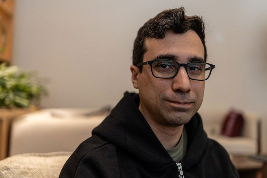 Noam Brown, a researcher behind OpenAI's recent AI breakthroughs in complex math and science reasoning, poses for a portrait at the company headquarters in San Francisco, California, May 20, 2025.