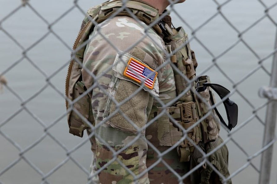 An Army National Guard soldier stands outside of a gate at the US-Mexico border in Eagle Pass, Texas, US, February 7, 2025.
