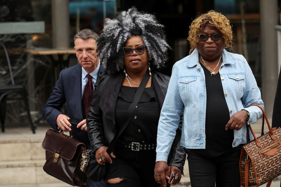 Bertrice Pompe and Bernadette Dugasse walk, following a court injunction that temporarily blocked the UK from concluding Chagos Islands deal with Mauritius, outside the High Court in London, Britain, May 22, 2025.