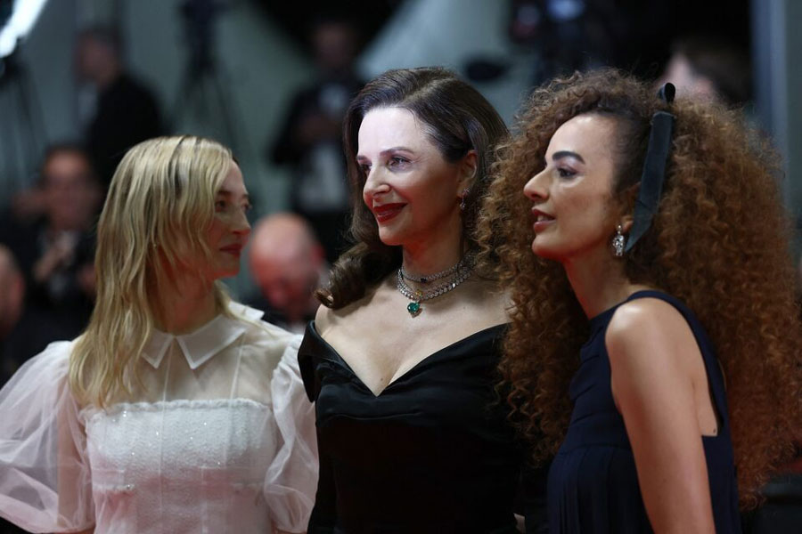 Juliette Binoche, Jury President of the 78th Cannes Film Festival and Jury members Alba Rohrwacher, Leila Sliman pose on the red carpet during arrivals for the screening of the film "Resurrection" (Kuang ye shi dai) in competition at the 78th Cannes Film Festival in Cannes, France, May 22, 2025.