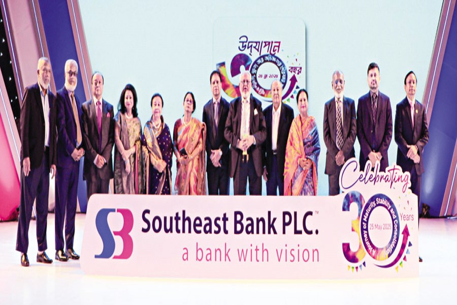 MA Kashem, chairman of Southeast Bank PLC, poses with other guests at the bank's 30th founding anniversary programme on Saturday.