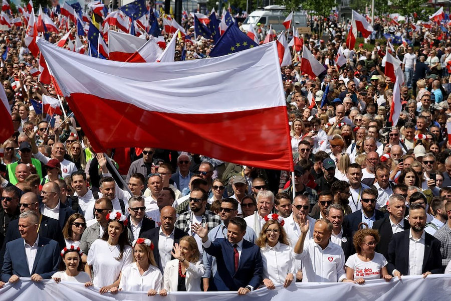 Polish Prime Minister Donald Tusk and Warsaw Mayor Rafal Trzaskowski, the presidential candidate of the Civic Coalition, attend the "Patriotic March" organised by the ruling party, ahead of the second round of presidential elections, in Warsaw, Poland, May 25, 2025.