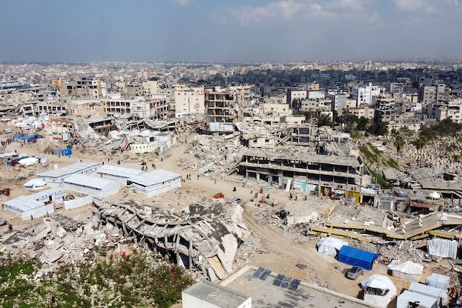 A drone view shows displaced Palestinians sheltering in tents set up near the rubble of buildings destroyed during the Israeli offensive, amid a ceasefire between Israel and Hamas, in Gaza City February 17, 2025.