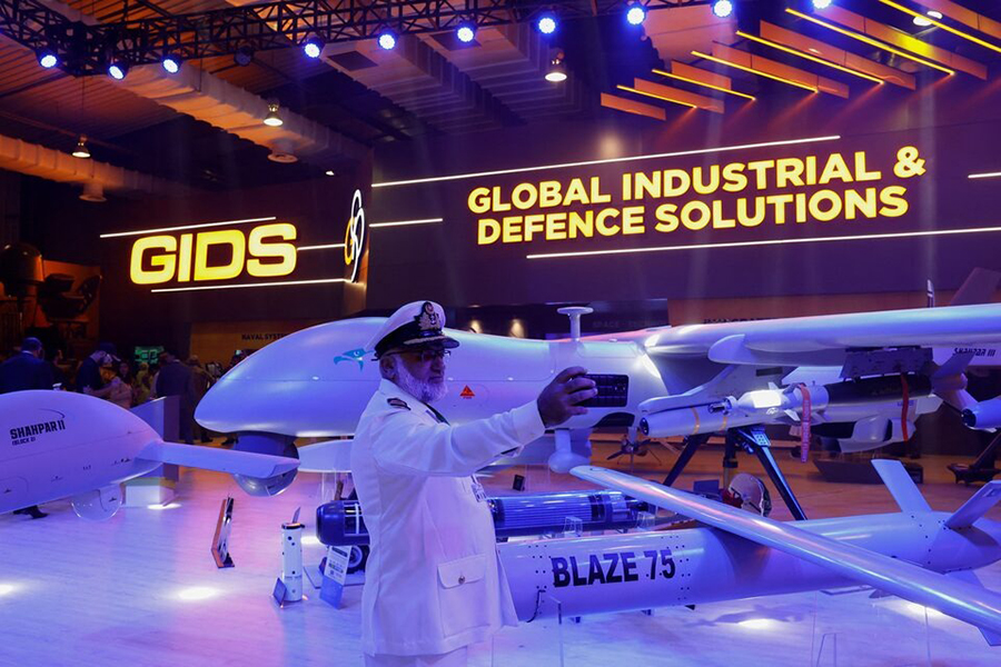 A member of Pakistan armed forces takes a selfie with Global Industrial & Defence Solutions (GIDS) unmanned combat aerial vehicle (UCAV) Shahpar during the International Defence Exhibition and Seminar (IDEAS 2024) in Karachi, Pakistan on November 21, 2024 — Reuters/File