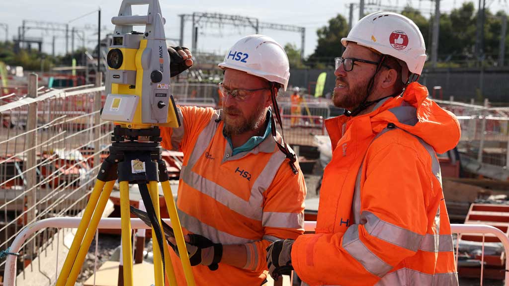 FILE PHOTO: Workers operate a piece of measuring equipment at the HS2 rail Curzon Street Station construction site in Birmingham, Britain, Oct 3, 2022. REUTERS/Phil Noble/File Photo