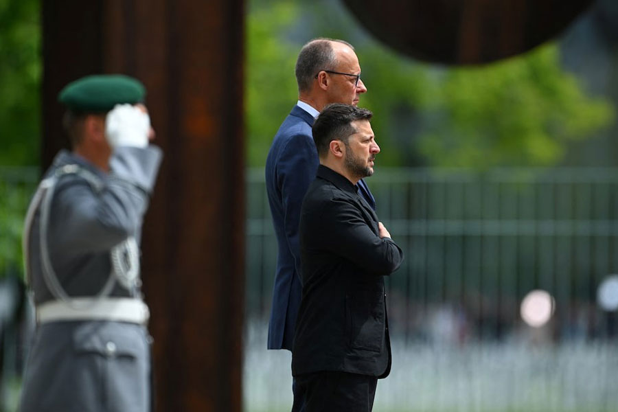German Chancellor Friedrich Merz and Ukraine's President Volodymyr Zelenskiy stand during the national anthems, in Berlin, Germany, May 28, 2025.