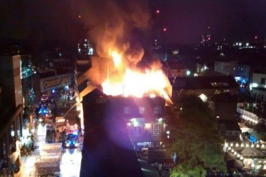 The first, second, and third floors and the roof of the building were on fire, the London Fire Brigade tweeted earlier.