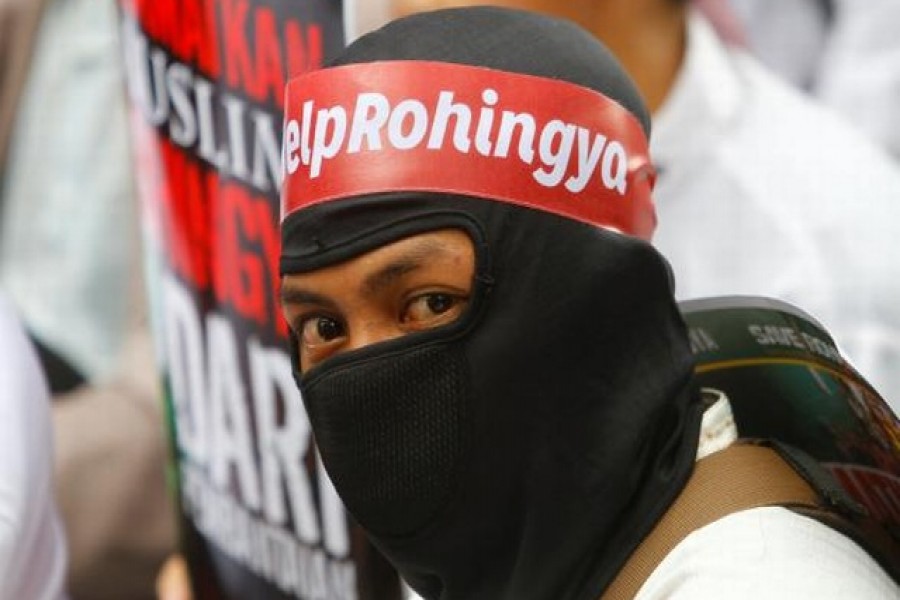 A protester wears a headband with "Help Rohingya" on it during a demonstration against what organisers say is the crackdown on ethnic Rohingya Muslims in Myanmar, outside the Myanmar embassy in Jakarta, Indonesia on November 25, 2016. –Reuters