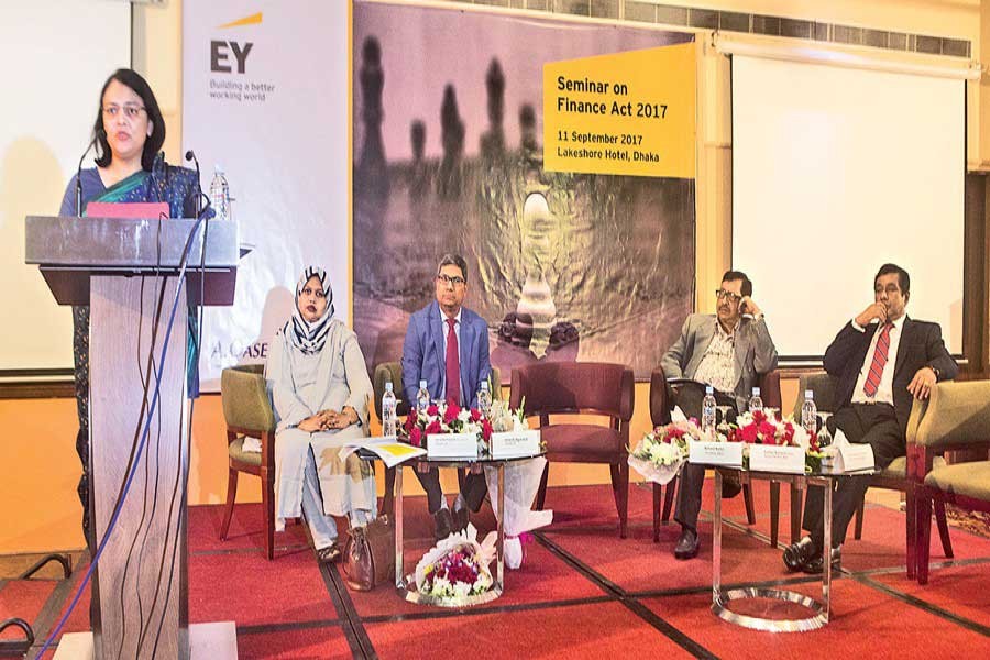 MCCI President Nihad Kabir speaks at a seminar on Finance Act 2017, organised by A. Qasem & Co. (AQC) at a Dhaka city hotel on Monday. FE Photo