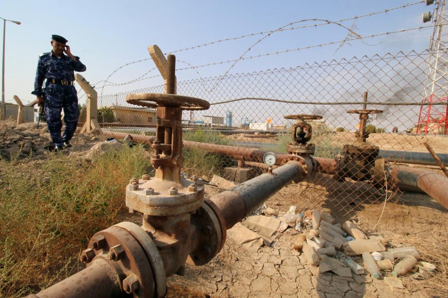 A member from the Oil Police Force is seen at Nahran Umran field norh of Basra, Iraq. — Reuters