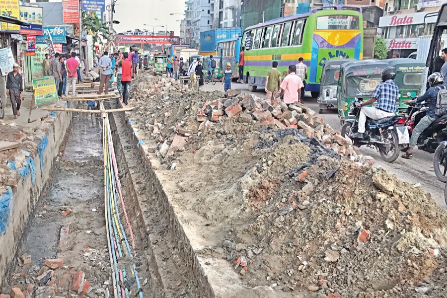 Road-digging for development work and the slow pace of work in different areas across the capital cause public sufferings. The photo has been taken from Kalyanpur area. — FE Photo