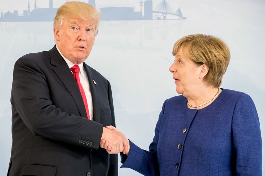 Donald Trump and Angela Merkel. The US’s inward turn leaves the world order without a main conductor. - Reuters