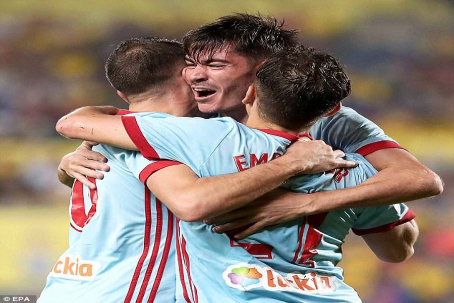 Aspas (L) celebrates with his teammates Jozabed (C) and Emre Mor (R) after scoring goal during the Spanish league match between Celta Vigo and Las Palmas at Gran Canaria Stadium in Madrid on Monday. — Internet