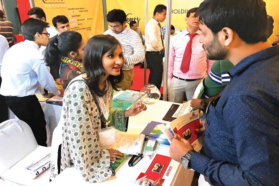 A visitor inquires about housing loan products at a three-day 'Housing Finance Fair-2017,' which began on Thursday in Dhaka. The Bangladesh House Building Finance Corporation is organising the fair. — FE Photo