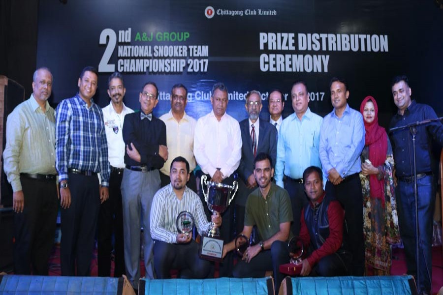 Chairman of A & J Group Ekramul Karim Chowdhury, MP, handing over prizes to the champions and runners-up of the Chittagong Club A & J National Snooker Championship 2017 at Chittagong Club on Thursday. — FE photo