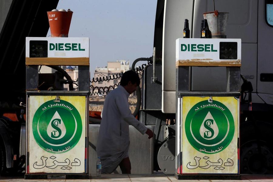 A man walks at a petrol station in Riyadh, Saudi Arabia recently. — Reuters