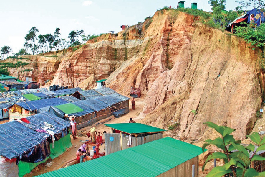 Rohingya refugees live in shanties on hill slopes at Ukhia in Cox's Bazar although a spell of downpour may trigger a landslide that may be devastating. The photo was taken on Thursday. — Focus Bangla