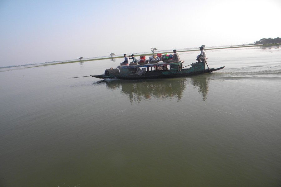Water still flowing in the haor protection embankment areas in Sunamganj. The photo was taken from Derai upazila on Monday. — FE Photo