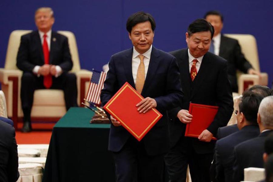 Lei Jun, Founder and CEO of China's smartphone maker Xiaomi, attends signing ceremony with US President Donald Trump and China's President Xi Jinping at the Great Hall of the People in Beijing on November 09, 2017. — Reuters