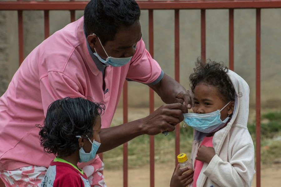 In this file photo, face masks were placed on children in Antananarivo, Madagascar. An outbreak of plague has killed at least 33 people. - AP photo