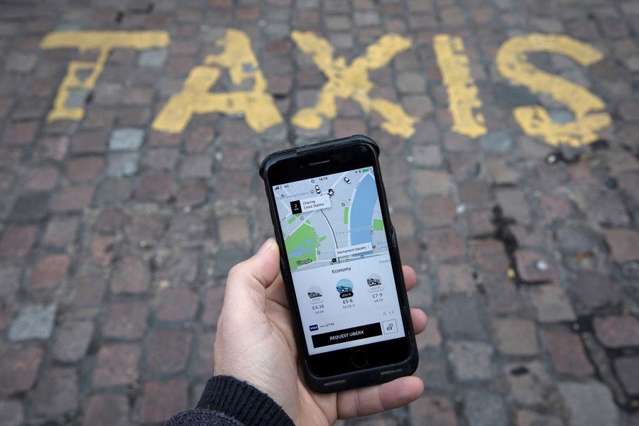 A photo illustration shows the Uber app on a mobile telephone, as it is held up for a posed photograph, in London, Britain November 10, 2017. Reuters