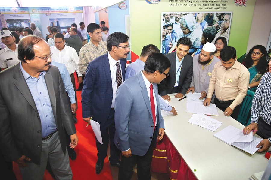 NBR Chairman Nojbur Rahman inspecting the Income Tax Week premises at Segunbagicha in Dhaka, which began on Friday — FE Photo