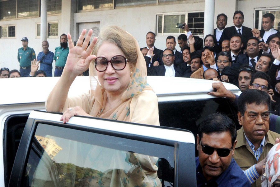 BNP Chairperson Khaleda Zia waves to party supporters after appearing before a special judge's court at Bakshibazar in the city on Tuesday in the Zia Orphanage Trust and Zia Charitable Trust graft cases. — Focus Bangla