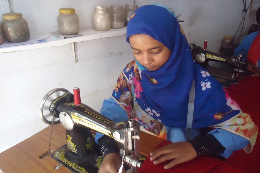 Shikha operates a sewing machine on Thursday. — FE Photo