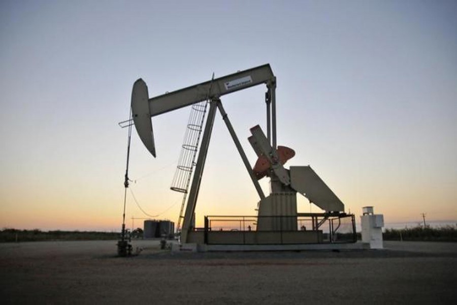 A pump jack operates at a well site leased by Devon Energy Production Company near Guthrie, Oklahoma, US. — Reuters