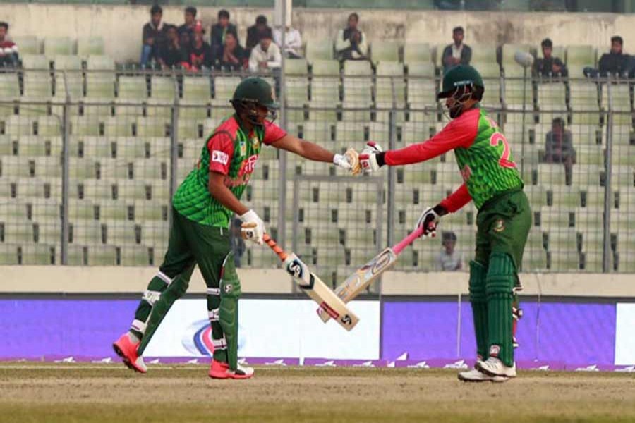 Allrounder Shakib Al Hasan and opener Tamim Iqbal celebrate after playing a shot during the third one day international (ODI) cricket match in the Tri-Nation Series between Bangladesh and Sri Lanka