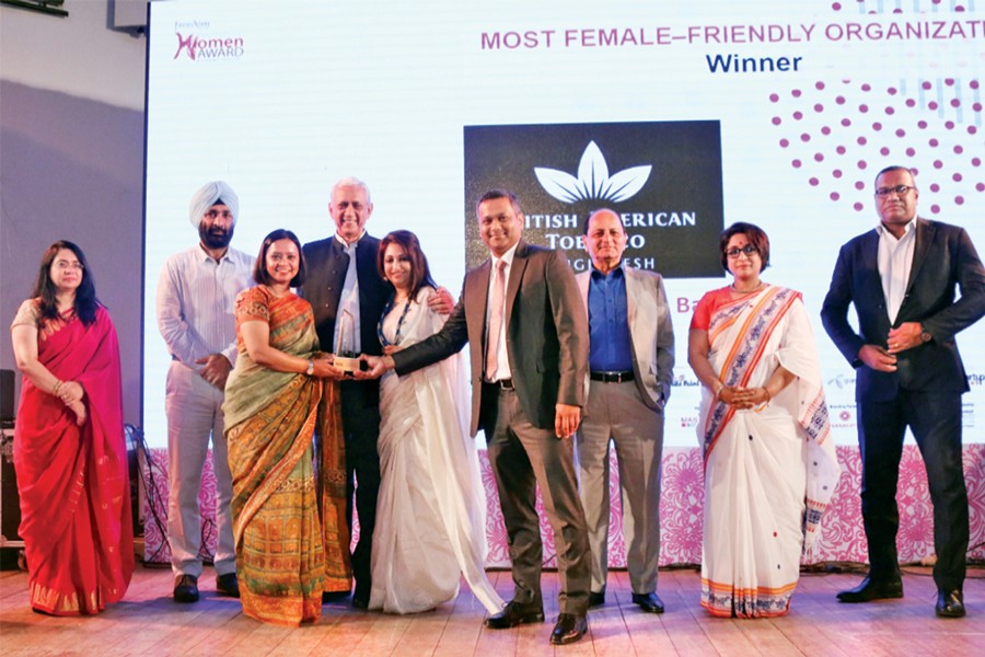 Shehzad Munim, Managing Director, Mubina Asaf, Head of Legal and External Affairs, and Rumana Rahman, Head of HR, BAT Bangladesh, receive the award from Gowher Rizvi, International Affairs Adviser to the prime minister, at a ceremony held at Shilpakala Academy in the city on Saturday.