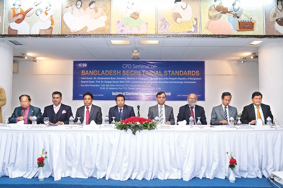 Shubhashish Bose (4th from left), Secretary, Ministry of Commerce addressing the Continuing Professional Development (CPD) seminar on "Bangladesh Secretarial Standards adopted by ICSB", arranged by Institute of Chartered Secretaries of Bangladesh (ICSB) Friday.