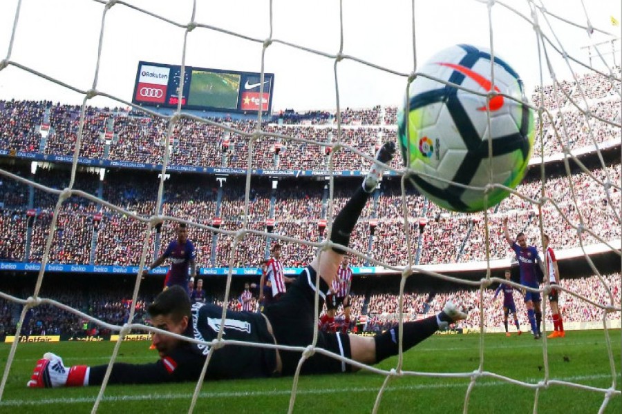 Barcelona's Lionel Messi scores his team's second goal - Reuters photo