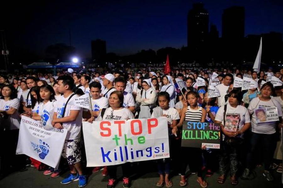 In this file photo, Participants display placards as they take part in a procession against plans to reimpose death penalty and intensify drug war during "Walk for Life" in Luneta park, Metro Manila, Philippines. - Reuters