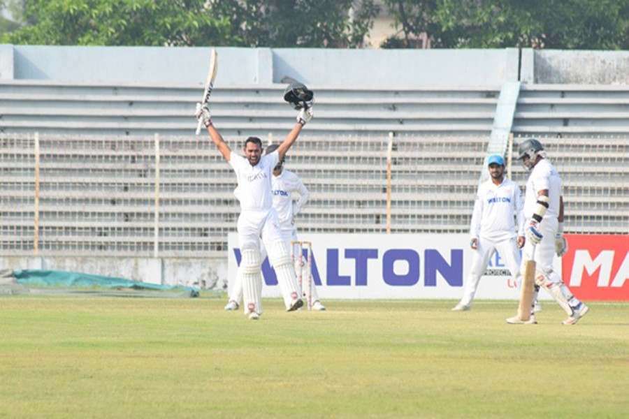 Central Zone's batsman Mohammad Mithun celebrating after hitting a century against South Zone after the 3rd day of the 5th round four-day match of BCL at Shaheed Kamruzzaman Stadium in Rajshahi on Thursday — bdnews24.com