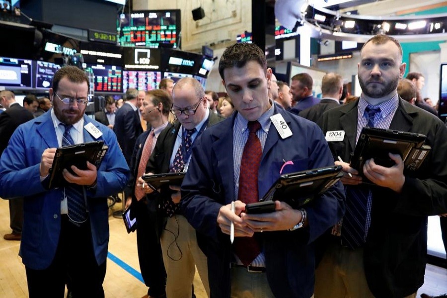 Traders work on the floor of the New York Stock Exchange in the Manhattan borough of New York City, New York, US, April 20, 2018. Reuters
