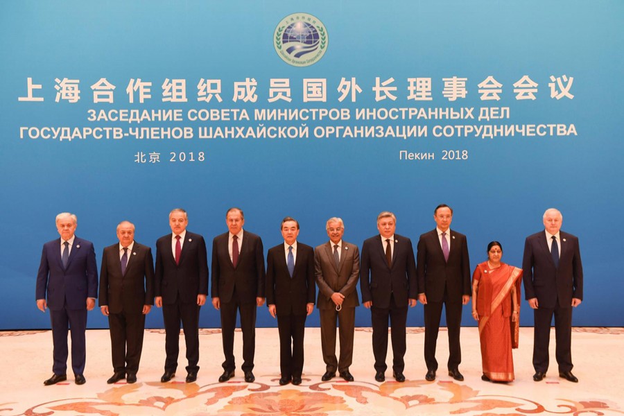 Foreign ministers and officials of the Shanghai Cooperation Organisation (SCO) posing for a group photograph before a meeting at the Diaoyutai State Guest House in Beijing, China on Tuesday — Reuters
