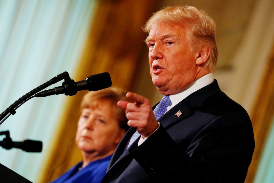 US President Donald Trump and Germany's Chancellor Angela Merkel holding a joint news conference in the East Room of the White House in Washington, US, on Friday — Reuters