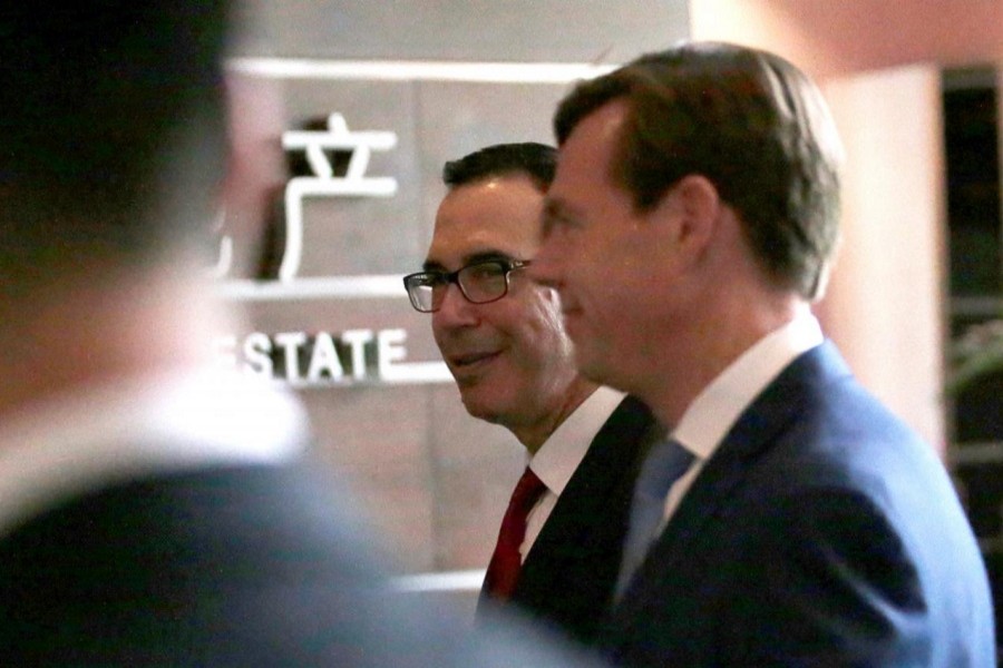 US Treasury Secretary Steven Mnuchin (C) is seen as he and the US delegation arrive at a hotel in Beijing, China May 3, 2018. Reuters