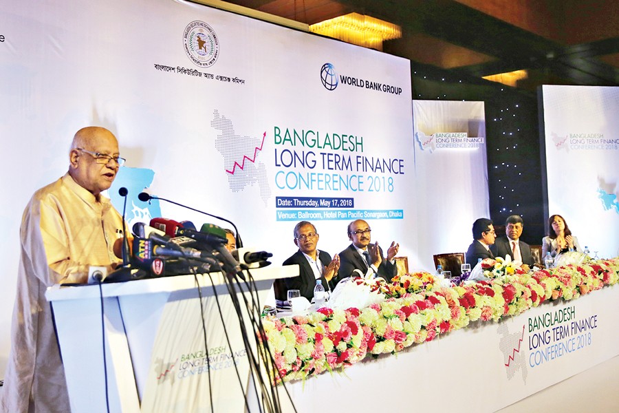 Finance Minister A M A Muhith speaking at Bangladesh Long Term Finance Conference 2018 at a city hotel on Thursday — FE Photo