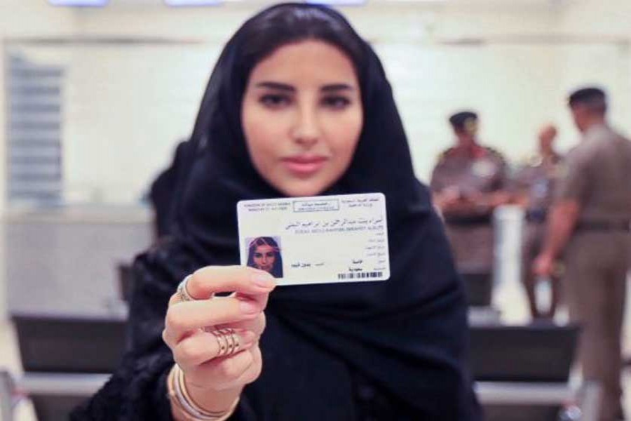 Esraa Albuti, an Executive Director at Ernst & Young, showing her brand new driving licence at the General Department of Traffic in the capital, Riyadh on Monday -AP photo